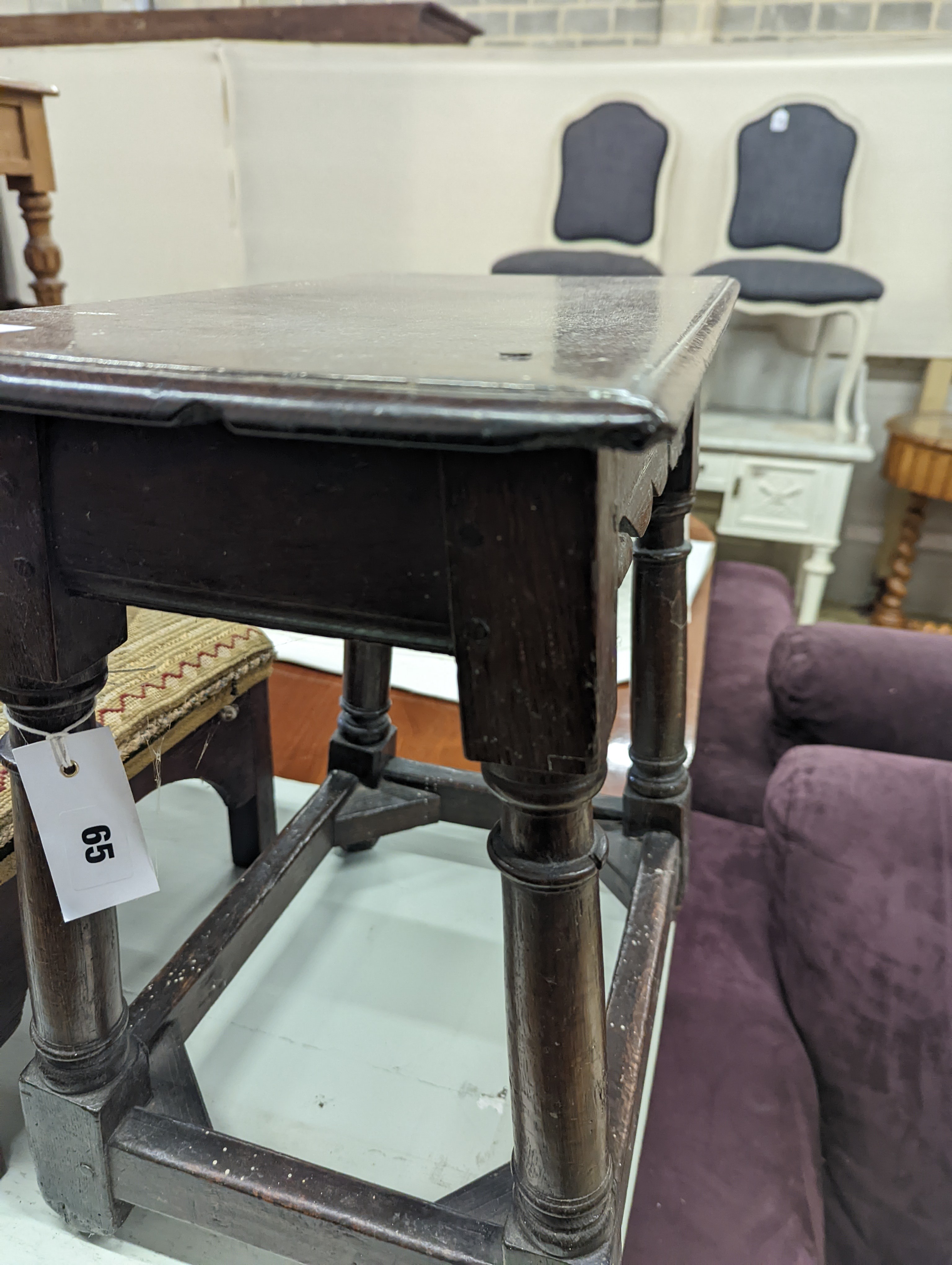 A 17th century style oak joint stool, width 46cm, depth 26cm, height 46cm and a George III stool with Victorian needlework seat, length 33cm